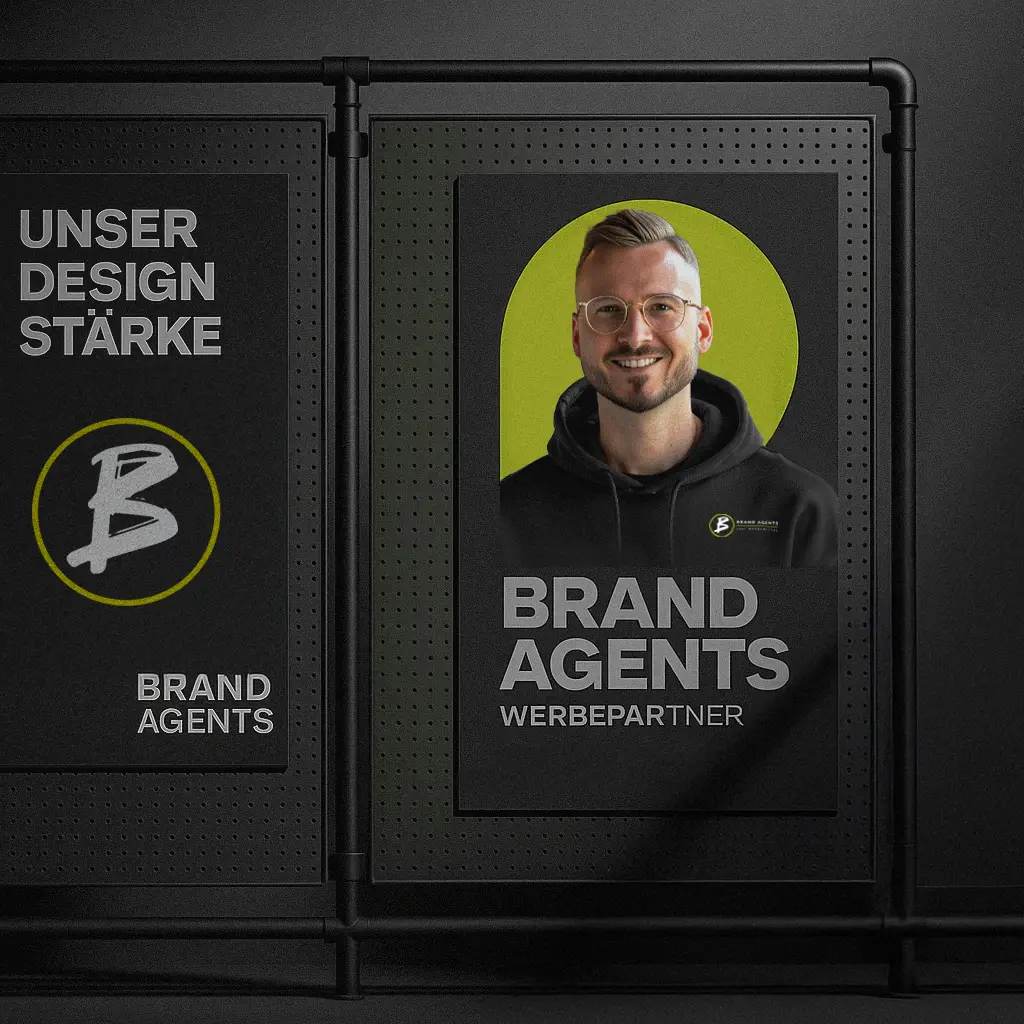 Mann mit Brille und schwarzem Hoodie vor einem grauen Hintergrund, mit einem gelben Akzent.